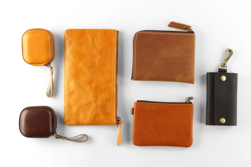 Selection of leather goods including wallets and cases